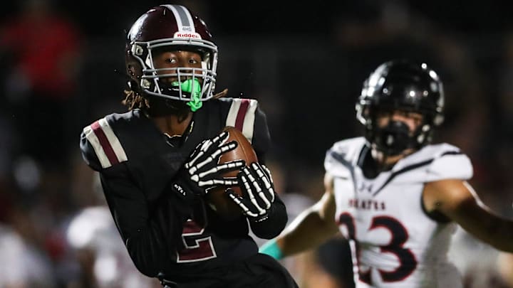 First Baptist Academy Lions receiver Bradley Martino (2) catches a pass for a touchdown during the first quarter of a game against the Port Charlotte Pirates at First Baptist Academy in Naples on Friday, Sept. 20, 2024. First Baptist Academy Lions receiver Bradley Martino (2) catches a pass for a touchdown during the first quarter of a game against the Port Charlotte Pirates at First Baptist Academy in Naples on Friday, Sept. 20, 2024.