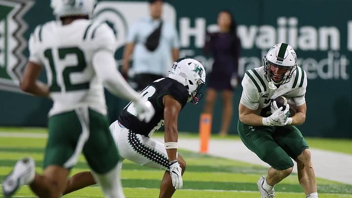 Sep 13, 2025; Honolulu, Hawaii, USA; Portland State Vikings quarterback Cru Newman (6) gets tackled by Hawaii Rainbow Warriors wide receiver Blaze Kamoku (80). Sep 13, 2025; Honolulu, Hawaii, USA; Portland State Vikings quarterback Cru Newman (6) gets tackled by Hawaii Rainbow Warriors wide receiver Blaze Kamoku (80).