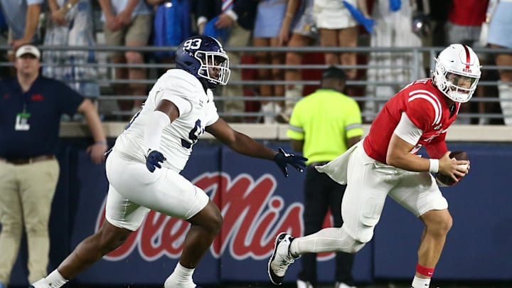 Sep 21, 2024; Oxford, Mississippi, USA; Mississippi Rebels quarterback Jaxson Dart (2) runs the ball as Georgia Southern Eagles defensive linemen Troy Pikes (93) pursues during the first half at Vaught-Hemingway Stadium. Mandatory Credit: Petre Thomas-Imagn Images Sep 21, 2024; Oxford, Mississippi, USA; Mississippi Rebels quarterback Jaxson Dart (2) runs the ball as Georgia Southern Eagles defensive linemen Troy Pikes (93) pursues during the first half at Vaught-Hemingway Stadium. Mandatory Credit: Petre Thomas-Imagn Images