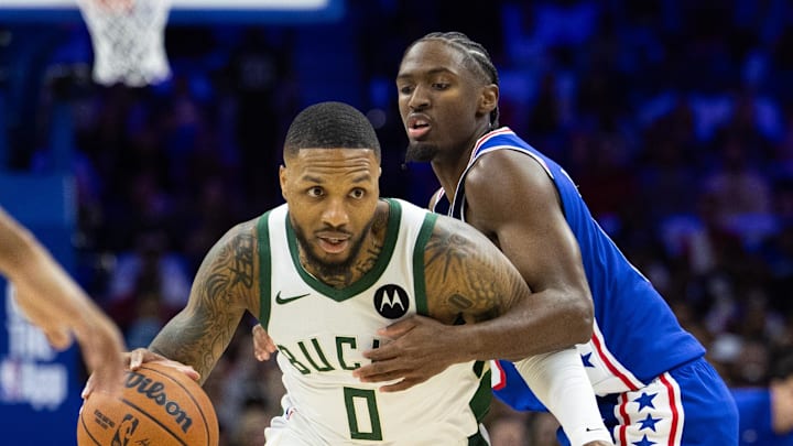 Oct 23, 2024; Philadelphia, Pennsylvania, USA; Milwaukee Bucks guard Damian Lillard (0) and Philadelphia 76ers guard Tyrese Maxey (0) in action during the first quarter at Wells Fargo Center. Mandatory Credit: Bill Streicher-Imagn Images