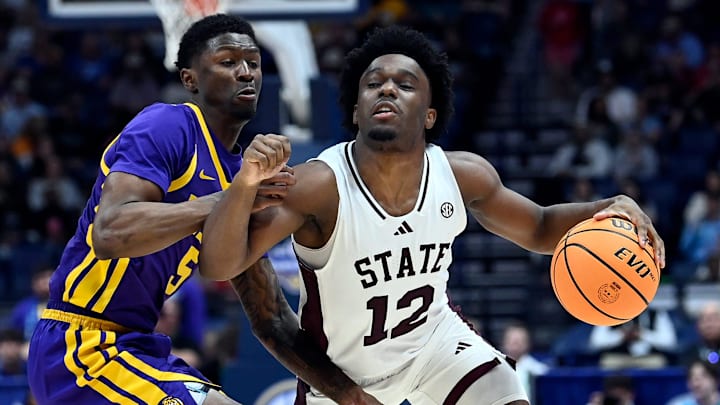 Mississippi State guard Josh Hubbard (12) drives around LSU guard Cam Carter (5) during a NCAA college basketball first round game at the men’s Southeastern Conference Tournament Wednesday, March 12, 2025, in Nashville, Tenn.