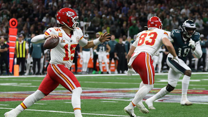 Feb 9, 2025; New Orleans, LA, USA; Kansas City Chiefs quarterback Patrick Mahomes (15) throws an interception as Philadelphia Eagles linebacker Josh Sweat (19) chases during Super Bowl LIX at Caesars Superdome. Mandatory Credit: Geoff Burke-Imagn Images