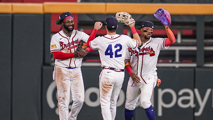 Apr 15, 2026; Cumberland, Georgia, USA; Atlanta Braves outfielders Michael Harris II Mike Yastrzemski and Ronald Acuna Jr react after the Braves defeated the Miami Marlins at Truist Park. All players are wearing number 42 today in honor of Jackie Robinson. Mandatory Credit: Dale Zanine-Imagn Images
