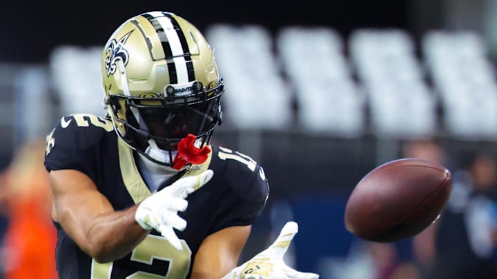 Sep 15, 2024; Arlington, Texas, USA; New Orleans Saints wide receiver Chris Olave (12) warms up before the game against the Dallas Cowboys at AT&T Stadium. Mandatory Credit: Kevin Jairaj-Imagn Images Sep 15, 2024; Arlington, Texas, USA; New Orleans Saints wide receiver Chris Olave (12) warms up before the game against the Dallas Cowboys at AT&T Stadium. Mandatory Credit: Kevin Jairaj-Imagn Images