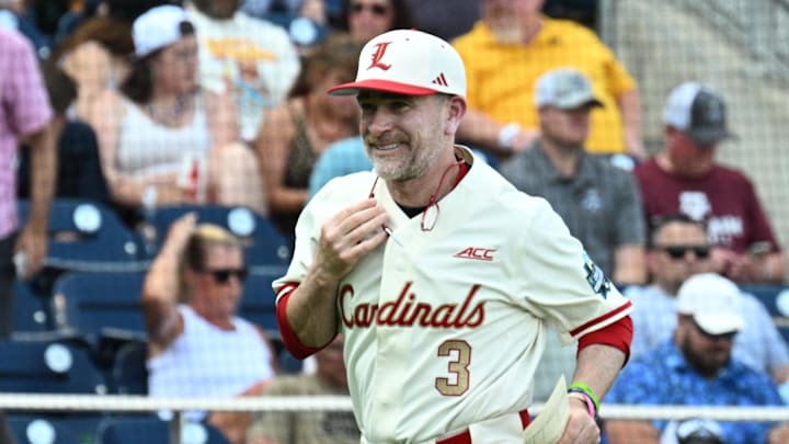 Jun 13, 2025; Omaha, Neb, USA; Louisville Cardinals head coach Dan McDonnell returns to the dugout before the game against the Oregon State Beavers at Charles Schwab Field. Mandatory Credit: Steven Branscombe-Imagn Images