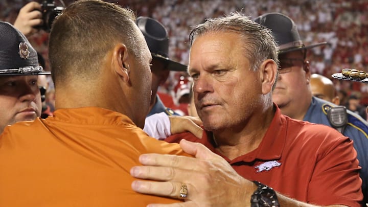 Arkansas Razorbacks coach Sam Pittman talks to Texas Longhorns head coach Steve Sarkisian after the game at Donald W. Reynolds Razorback Stadium. Arkansas won 40-21. 