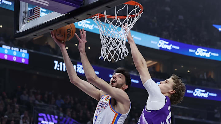 Feb 6, 2024; Salt Lake City, Utah, USA; Oklahoma City Thunder forward Chet Holmgren (7) shoots a layup against Utah Jazz forward Lauri Markkanen (23) during the first quarter at Delta Center. Mandatory Credit: Rob Gray-Imagn Images