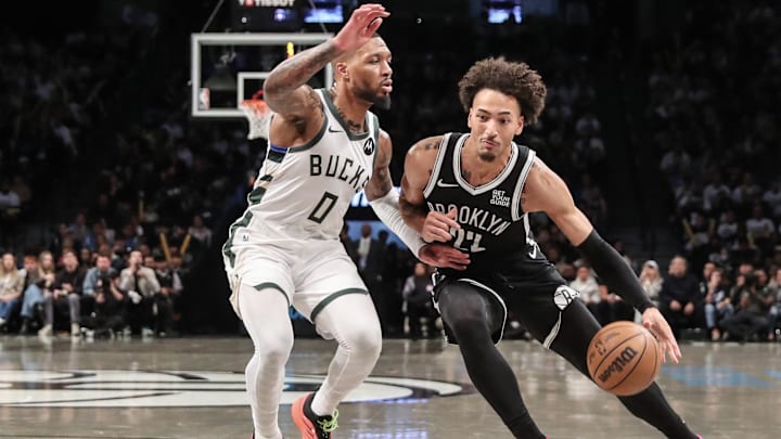 Oct 27, 2024; Brooklyn, New York, USA;  Brooklyn Nets forward Jalen Wilson (22) drives past Milwaukee Bucks guard Damian Lillard (0) in the third quarter at Barclays Center. Mandatory Credit: Wendell Cruz-Imagn Images