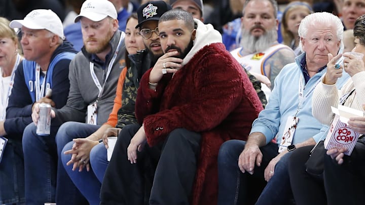 Dec 1, 2021; Oklahoma City, Oklahoma, USA; Rapper, singer and actor Drake watches the Oklahoma City Thunder take on the Houston Rockets during the second half of an Oklahoma City Thunder game at Paycom Center. Mandatory Credit: Alonzo Adams-Imagn Images Dec 1, 2021; Oklahoma City, Oklahoma, USA; Rapper, singer and actor Drake watches the Oklahoma City Thunder take on the Houston Rockets during the second half of an Oklahoma City Thunder game at Paycom Center. Mandatory Credit: Alonzo Adams-Imagn Images
