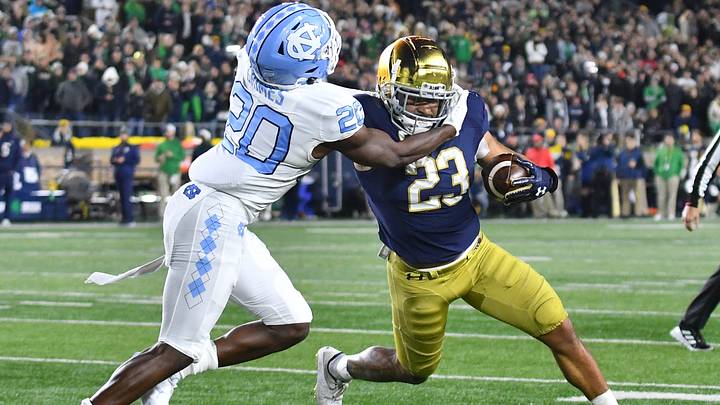 Oct 30, 2021; South Bend, Indiana, USA; Notre Dame Fighting Irish running back Kyren Williams (23) carries the ball as North Carolina Tar Heels cornerback Tony Grimes (20) defends in the fourth quarter at Notre Dame Stadium. Oct 30, 2021; South Bend, Indiana, USA; Notre Dame Fighting Irish running back Kyren Williams (23) carries the ball as North Carolina Tar Heels cornerback Tony Grimes (20) defends in the fourth quarter at Notre Dame Stadium.
