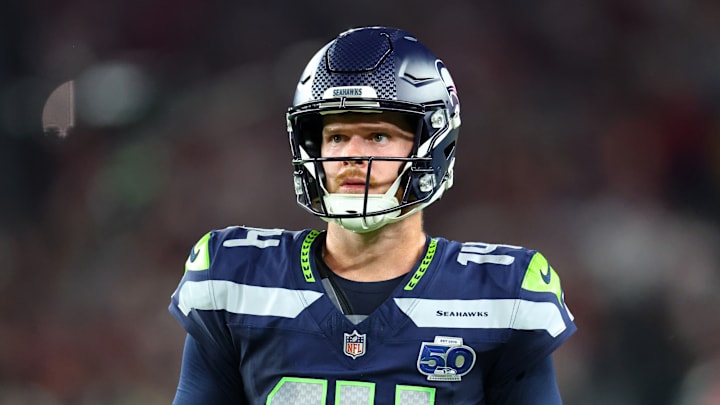 Sep 25, 2025; Glendale, Arizona, USA; Seattle Seahawks quarterback Sam Darnold (14) looks on in the second half against the Arizona Cardinals at State Farm Stadium. 
