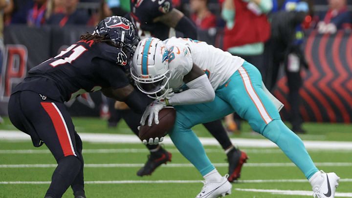Miami Dolphins wide receiver Grant DuBose (88) is tackled by Houston Texans safety Calen Bullock (21) in the third quarter at NRG Stadium. Miami Dolphins wide receiver Grant DuBose (88) was injured on the play and had to leave the game. Miami Dolphins wide receiver Grant DuBose (88) is tackled by Houston Texans safety Calen Bullock (21) in the third quarter at NRG Stadium. Miami Dolphins wide receiver Grant DuBose (88) was injured on the play and had to leave the game.