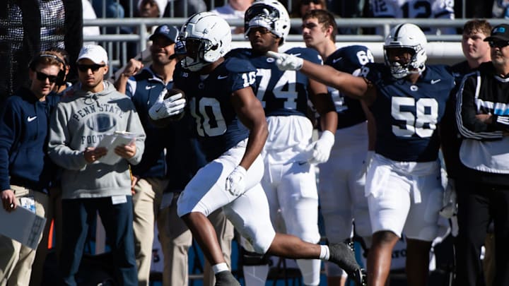 Penn State running back Nick Singleton runs down the sideline in the first half against Ohio State at Beaver Stadium.
