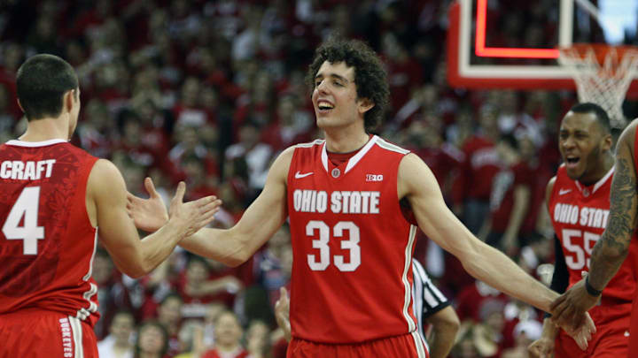 Feb 1, 2014; Madison, WI, USA; Ohio State Buckeyes guard Amedeo Della Valle (33) celebrates his team's victory over the Wisconsin Badgers  at the Kohl Center. Ohio State defeated Wisconsin 59-58. Mandatory Credit: Mary Langenfeld-Imagn Images