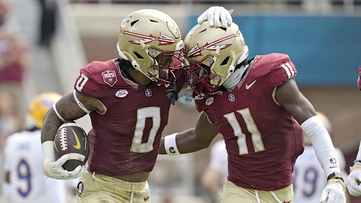 Oct 11, 2025; Tallahassee, Florida, USA; Florida State Seminoles safety Earl Little Jr. (0) and defensive back Ja'Bril Rawls (11) celebrate after an interception during the first half of the game against the Pittsburgh Panthers at Doak S. Campbell Stadium. Mandatory Credit: Melina Myers-Imagn Images
