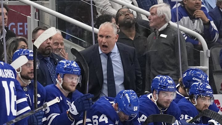 May 14, 2025; Toronto, Ontario, CAN; Toronto Maple Leafs head coach Craig Berube (center dark suit) talks to his players during the first period of game five of the second round of the 2025 Stanley Cup Playoffs against the Florida Panthers at Scotiabank Arena. 
