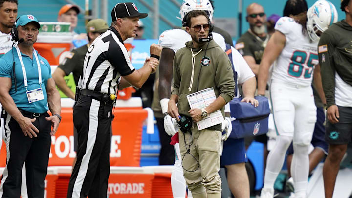 Miami Dolphins head coach Mike McDaniel talks to an official during the first half against the Buffalo Bills at Hard Rock Stadium. 