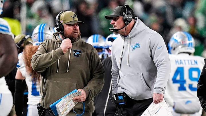 Detroit Lions head coach Dan Campbell, right, talks to offensive line coach Hank Fraley before a play against Philadelphia Eagles during the second half at Lincoln Financial Field in Philadelphia on Sunday, November 16, 2025.