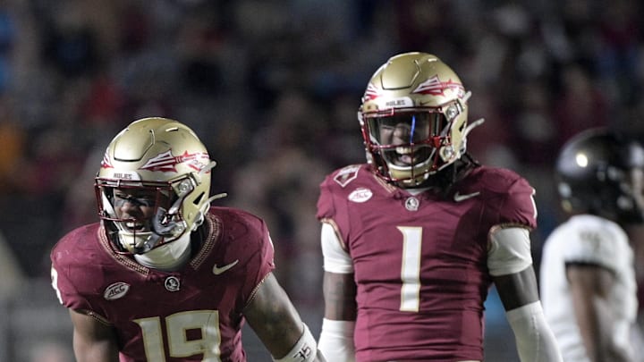 Nov 1, 2025; Tallahassee, Florida, USA; Florida State Seminoles defensive back Jerry Wilson (19) celebrates a big tackle with defensive back Shyheim Brown (1) during the second half at Doak S. Campbell Stadium. Mandatory Credit: Melina Myers-Imagn Images Nov 1, 2025; Tallahassee, Florida, USA; Florida State Seminoles defensive back Jerry Wilson (19) celebrates a big tackle with defensive back Shyheim Brown (1) during the second half at Doak S. Campbell Stadium. Mandatory Credit: Melina Myers-Imagn Images