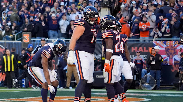 Nov 23, 2025; Chicago, Illinois, USA; Chicago Bears running back Kyle Monangai (25) reacts with offensive tackle Ozzy Trapilo (75) after scoring a touchdown against the Pittsburgh Steelers during the second half at Soldier Field. Mandatory Credit: David Banks-Imagn Images