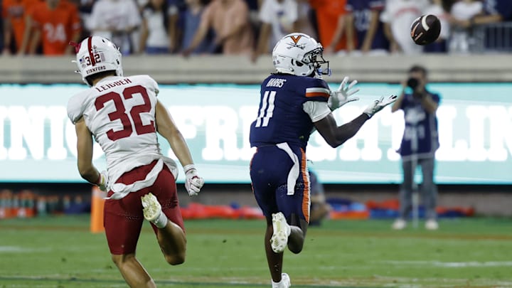 Sep 20, 2025; Charlottesville, Virginia, USA; Virginia Cavaliers wide receiver Trell Harris (11) catcher he's a pass en route to a touchdown as Stanford Cardinal safety Mitch Leigber (32) chases during the first quarter at Scott Stadium. Mandatory Credit: Geoff Burke-Imagn Images Sep 20, 2025; Charlottesville, Virginia, USA; Virginia Cavaliers wide receiver Trell Harris (11) catcher he's a pass en route to a touchdown as Stanford Cardinal safety Mitch Leigber (32) chases during the first quarter at Scott Stadium. Mandatory Credit: Geoff Burke-Imagn Images