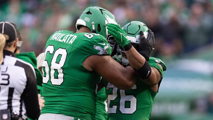Dec 29, 2024; Philadelphia, Pennsylvania, USA; Philadelphia Eagles running back Saquon Barkley (26) celebrates with offensive tackle Jordan Mailata (68) after rushing for 167 yards in a game against the Dallas Cowboys at Lincoln Financial Field. Mandatory Credit: Bill Streicher-Imagn Images Dec 29, 2024; Philadelphia, Pennsylvania, USA; Philadelphia Eagles running back Saquon Barkley (26) celebrates with offensive tackle Jordan Mailata (68) after rushing for 167 yards in a game against the Dallas Cowboys at Lincoln Financial Field. Mandatory Credit: Bill Streicher-Imagn Images