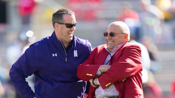 Oct 12, 2013; Madison, WI, USA; Northwestern Wildcats head coach Pat Fitzgerald talks with Wisconsin Badgers athletic coordinator Barry Alvarez prior to the game at Camp Randall Stadium.  Wisconsin won 35-6.  Mandatory Credit: Jeff Hanisch-Imagn Images