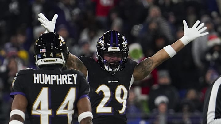 Dec 21, 2025; Baltimore, Maryland, USA;  Baltimore Ravens safety Ar'Darius Washington (29) celebrates forcing a fumble by New England Patriots quarterback Drake Maye (not pictured) during the first half of the game at M&T Bank Stadium. Mandatory Credit: James Lang-Imagn Images
