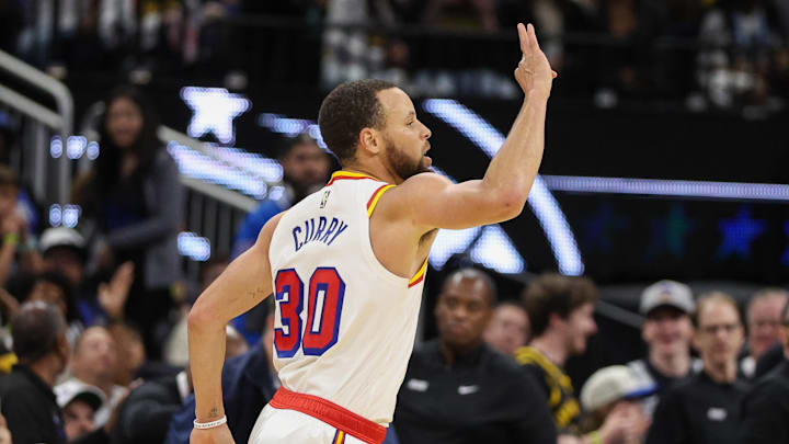 Golden State Warriors guard Stephen Curry (30) reacts after a basket against the Orlando Magic in the third quarter at Kia Center. 