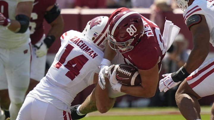 Sep 13, 2025; Tuscaloosa, Alabama, USA;  Wisconsin defensive back Preston Zachman (14) makes a tackle on Alabama tight end Josh Cuevas (80) at Saban Field at Bryant-Denny Stadium. 