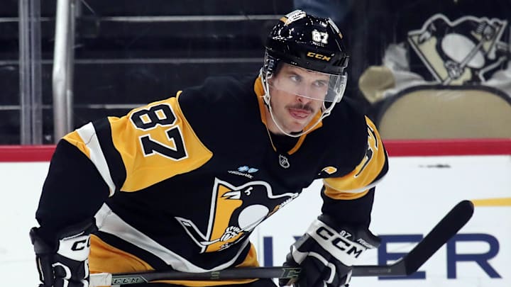 Nov 11, 2024; Pittsburgh, Pennsylvania, USA;  Pittsburgh Penguins center Sidney Crosby (87) prepares to take a face-off against the Dallas Stars during the first period at PPG Paints Arena. Mandatory Credit: Charles LeClaire-Imagn Images