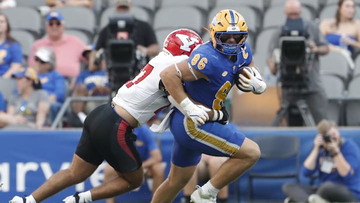 Sep 21, 2024; Pittsburgh, Pennsylvania, USA; Pittsburgh Panthers tight end Gavin Bartholomew (86) runs after a catch against the Youngstown State Penguins during the third quarter at Acrisure Stadium. Mandatory Credit: Charles LeClaire-Imagn Images