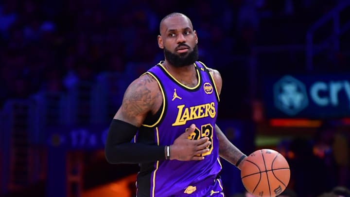 Feb 25, 2025; Los Angeles, California, USA; Los Angeles Lakers forward LeBron James (23) dribbles the ball against the Dallas Mavericks during the second half at Crypto.com Arena. Mandatory Credit: Gary A. Vasquez-Imagn Images