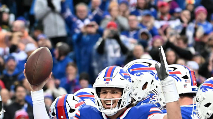 Buffalo Bills quarterback Josh Allen (17) celebrates after scoring a rushing touchdown against the New York Jets