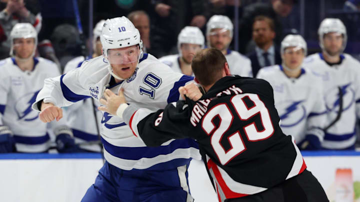 Mar 8, 2026; Buffalo, New York, USA;  Tampa Bay Lightning right wing Corey Perry (10) and Buffalo Sabres left wing Beck Malenstyn (29) fight during the second period at KeyBank Center. Mandatory Credit: Timothy T. Ludwig-Imagn Images