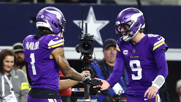 Dec 14, 2025; Arlington, Texas, USA; Minnesota Vikings wide receiver Jalen Nailor (1) celebrates with quarterback J.J. McCarthy (9) after a touchdown catch during the second half against the Dallas Cowboys at AT&T Stadium.  