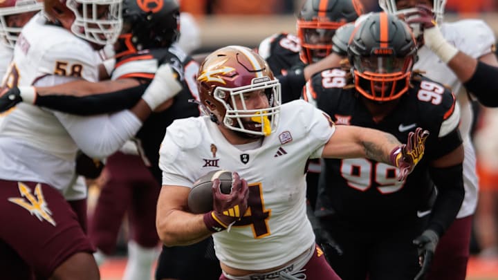 Nov 2, 2024; Stillwater, Oklahoma, USA; Arizona State Sun Devils running back Cam Skattebo (4) runs the ball during the first quarter against the Oklahoma State Cowboys at Boone Pickens Stadium. Mandatory Credit: William Purnell-Imagn Images Nov 2, 2024; Stillwater, Oklahoma, USA; Arizona State Sun Devils running back Cam Skattebo (4) runs the ball during the first quarter against the Oklahoma State Cowboys at Boone Pickens Stadium. Mandatory Credit: William Purnell-Imagn Images