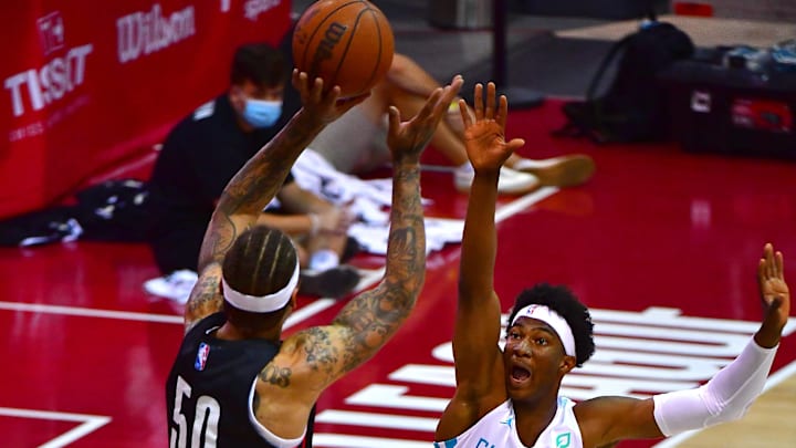 Aug 8, 2021; Las Vegas, Nevada, USA;  Charlotte Hornets forward Kai Jones (23) defends against a shot attempt by Portland Trail Blazers forward Michael Beasley (50) during an NBA Summer League game at Cox Pavilion. Mandatory Credit: Stephen R. Sylvanie-Imagn Images