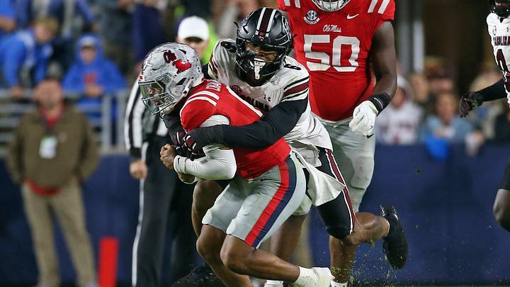 Nov 1, 2025; Oxford, Mississippi, USA; South Carolina Gamecocks defensive end Dylan Stewart (6) tackles Mississippi Rebels quarterback Trinidad Chambliss (6) during the second quarter at Vaught-Hemingway Stadium. Mandatory Credit: Petre Thomas-Imagn Images