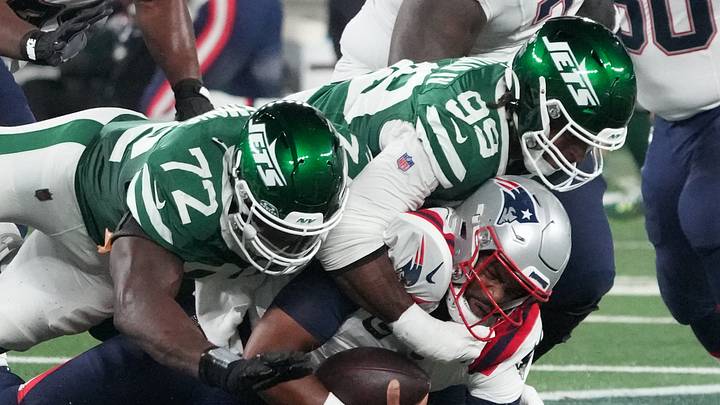Sep 19, 2024; East Rutherford, New Jersey, USA; New England Patriots quarterback Jacoby Brissett (7) sacked by New York Jets defensive end Micheal Clemons (72) and defensive end Will McDonald IV (99) in the 1st half at MetLife Stadium. Mandatory Credit: Robert Deutsch-Imagn Images Sep 19, 2024; East Rutherford, New Jersey, USA; New England Patriots quarterback Jacoby Brissett (7) sacked by New York Jets defensive end Micheal Clemons (72) and defensive end Will McDonald IV (99) in the 1st half at MetLife Stadium. Mandatory Credit: Robert Deutsch-Imagn Images
