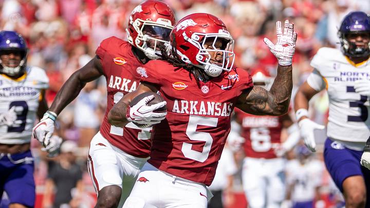 Arkansas Razorbacks running back Sutton Smith looks for running room during a first quarter punt return that was called back due to a penalty against North Alabama. 