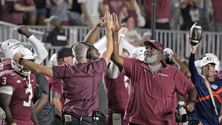Sep 21, 2024; Tallahassee, Florida, USA; Florida State Seminoles head coach Mike Norvell and associate head coach Odell Haggins high-five after winning against the California Golden Bears at Doak S. Campbell Stadium. Mandatory Credit: Melina Myers-Imagn Images