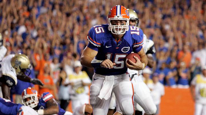 September 5, 2008; Gainesville FL, USA; Florida Gators quarterback Tim Tebow (15) scores a touchdown during the first half against the Charleston Southern Buccaneers at Ben Hill Griffin Stadium. Mandatory Credit: Kim Klement-USA TODAY Sports