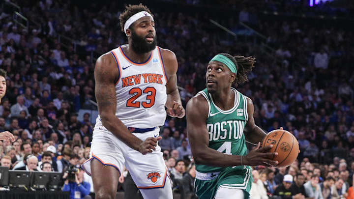 Oct 25, 2023; New York, New York, USA; Boston Celtics guard Jrue Holiday (4) looks to drive past New York Knicks center Mitchell Robinson (23) in the second quarter at Madison Square Garden. Mandatory Credit: Wendell Cruz-Imagn Images