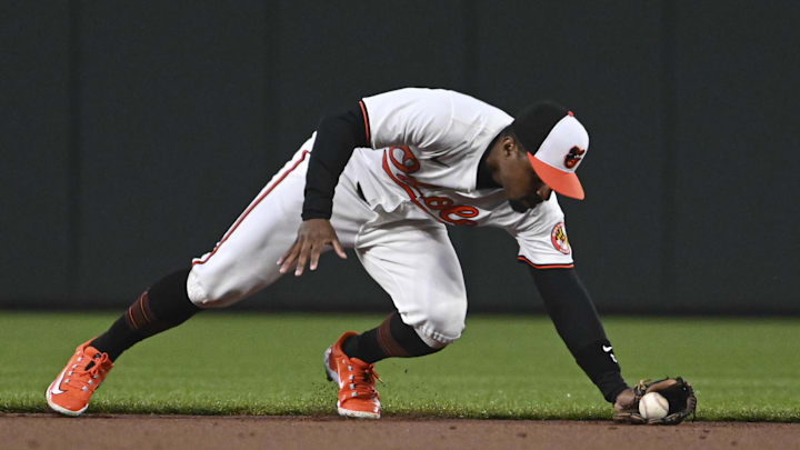 Apr 2, 2024; Baltimore, Maryland, USA;  Baltimore Orioles second baseman Tony Kemp (12) reaches for 