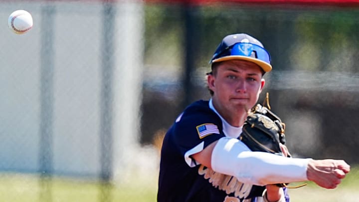 Brock Lustic of Eau Gallie throws out an IMG Academy Navy baserunner during their game in the Prospect Select High School Spring Open baseball tournament at USSSA complex in Viera last month. Last week, he struck out 10 in a complete-game, two-hit shutout, to propel the Commodores past Rockledge, 5-0. 