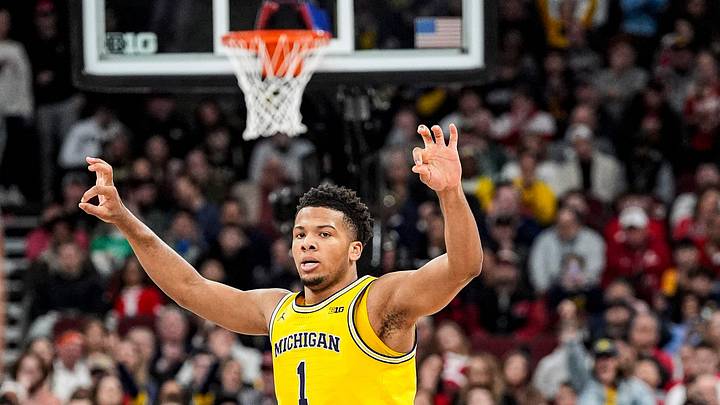 Michigan guard Trey McKenney (1) celebrates a 3-pointer against Wisconsin during the first half of Big Ten Tournament semifinal at United Center in Chicago on Saturday, March 14, 2026.