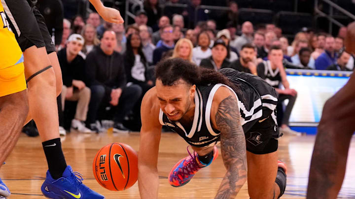 Mar 15, 2024; New York City, NY, USA; Providence Friars guard Devin Carter (22) falls while driving against Marquette Golden Eagles during the second half at Madison Square Garden. Mandatory Credit: Robert Deutsch-USA TODAY Sports Mar 15, 2024; New York City, NY, USA; Providence Friars guard Devin Carter (22) falls while driving against Marquette Golden Eagles during the second half at Madison Square Garden. Mandatory Credit: Robert Deutsch-USA TODAY Sports