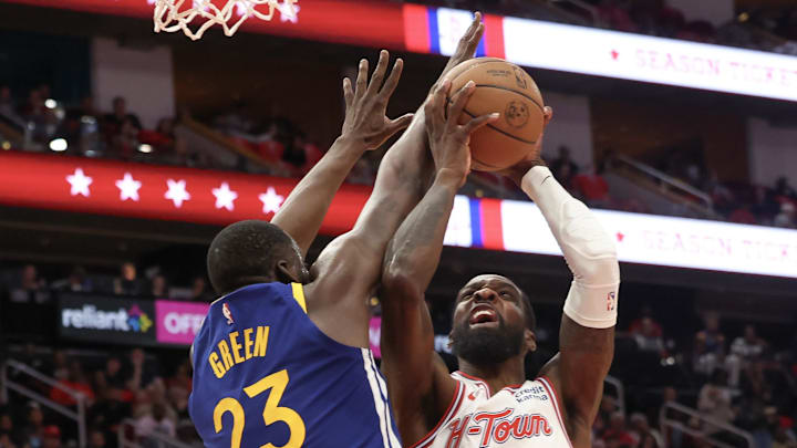 Apr 4, 2024; Houston, Texas, USA; Houston Rockets forward Jeff Green (32) shoots against Golden State Warriors forward Draymond Green (23) in the second half at Toyota Center. Mandatory Credit: Thomas Shea-Imagn Images