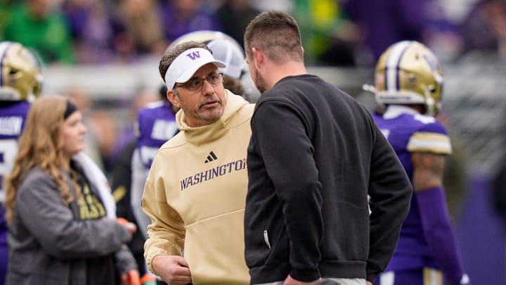 Washington head coach Jedd Fisch, left, and Oregon head coach Dan Lanning talk before the game as the Oregon Ducks take on the Washington Huskies on Nov. 29, 2025, at Husky Stadium in Seattle, Washington.